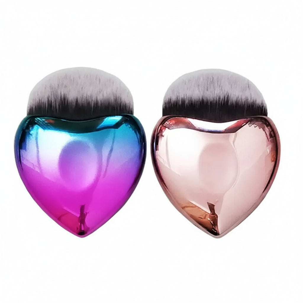 Two heart-shaped makeup brushes with colorful handles on a white background