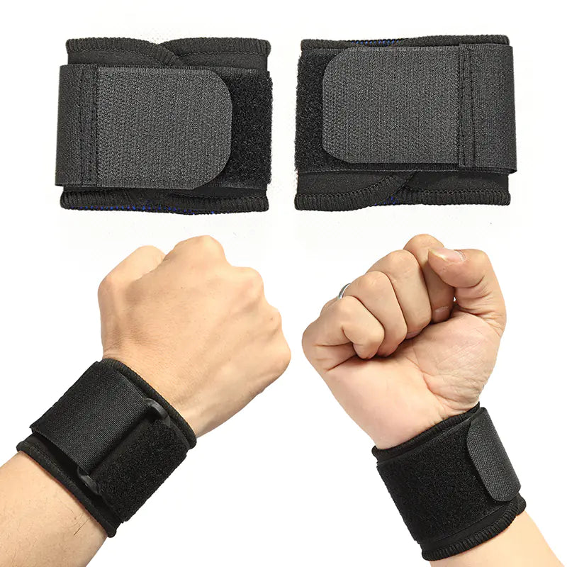 Black wrist supports on wrists with fists clenched, showing their fit.