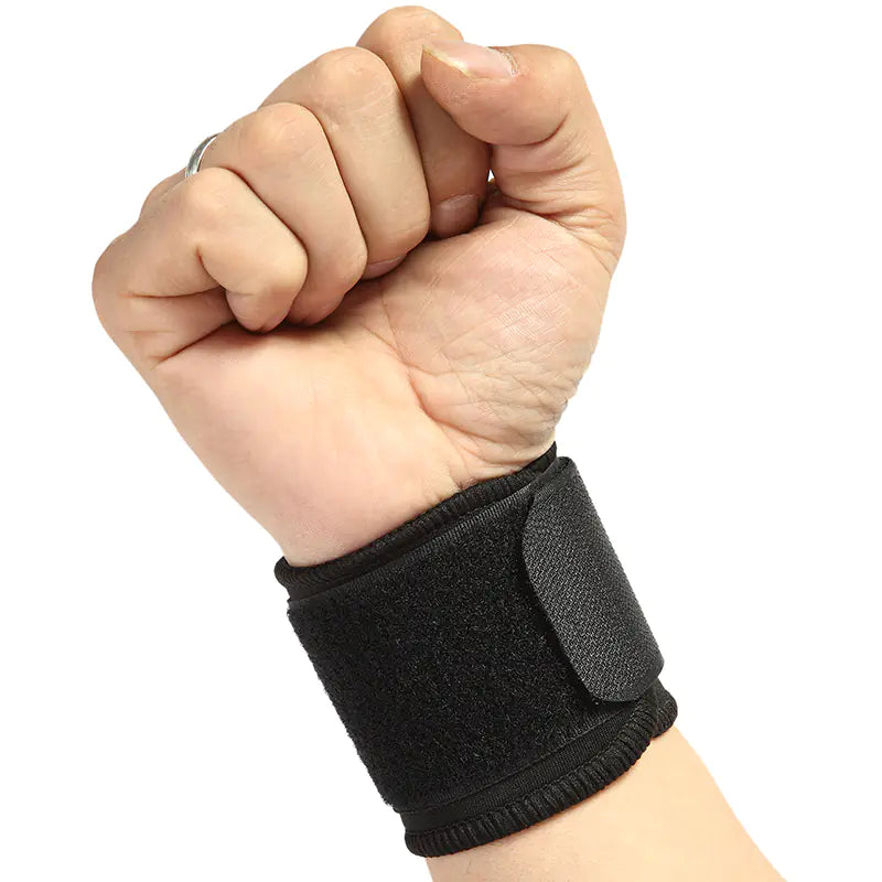 Hand wearing a black wrist support brace on a white background