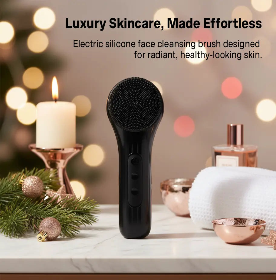 Black electric silicone face cleansing brush on a decorative surface with lights in the background
